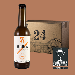 Im Vordergrund sieht man die Flasche und im Hintergrund der 24er Karton in dem die Flaschen verpackt und versendet werden.