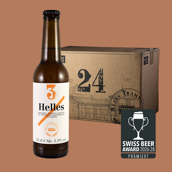 Im Vordergrund sieht man die Flasche und im Hintergrund der 24er Karton in dem die Flaschen verpackt und versendet werden.