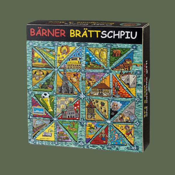 Das Bärner Brättschpiu ist auf dem Foto abgebildet. Es hat ganz viele Dreiecke auf der Schachtel in denen Berner Sehenswürdigkeiten im Comicstile zu sehen sind.
